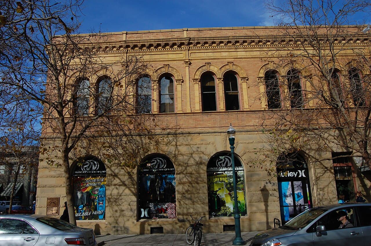 Historic bank building with arched storefront windows on Pacific Avenue in downtown Santa Cruz.